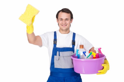 Professional carpet cleaner in NW2 deep cleaning a living room carpet